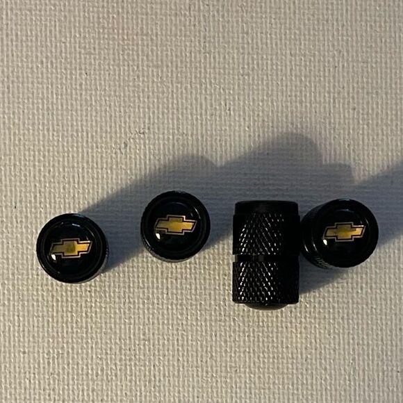 Chevrolet Logo valve Stem caps in black set of 4 NWT - Picture 1 of 4